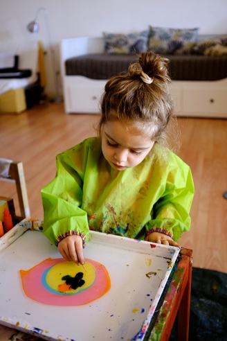 Child using Marbling Ink Kit for Japanese Suminagashi and Chopstick wearing IKEA MÅLA Art Smock